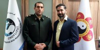 بازوبند پهلوانی بر بازوی ورزشکار ناجا دکتر علی یار فلاح